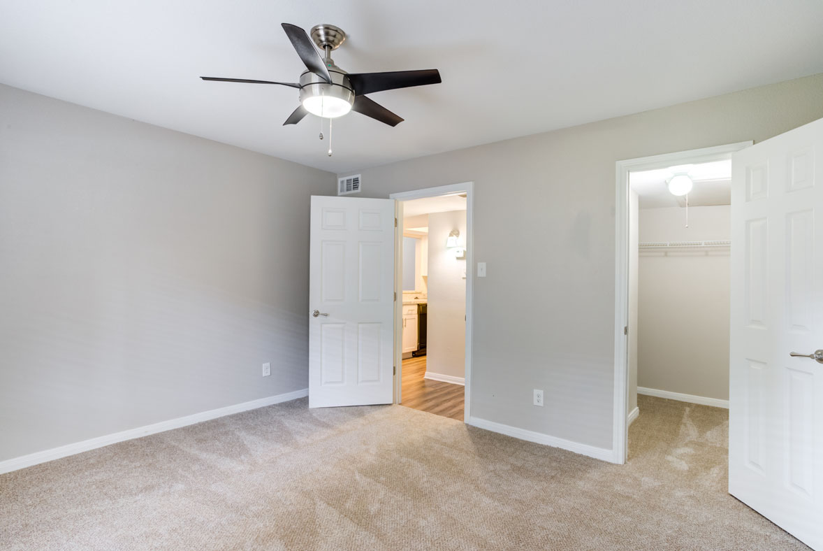 Bedroom with walk-in closet, typical of Cedar